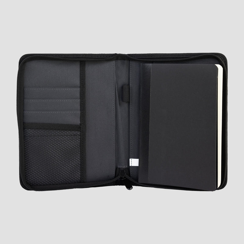 interior of Charcoal Mensa Refillable Journal showing mesh pockets and refillable journal