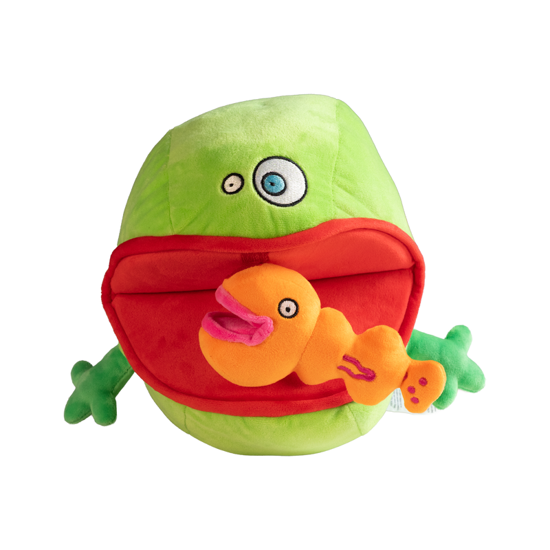 Green plush toy with a red mouth holding an orange plush toy 