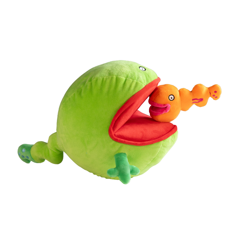 Green plush toy with a red mouth holding an orange plush toy 