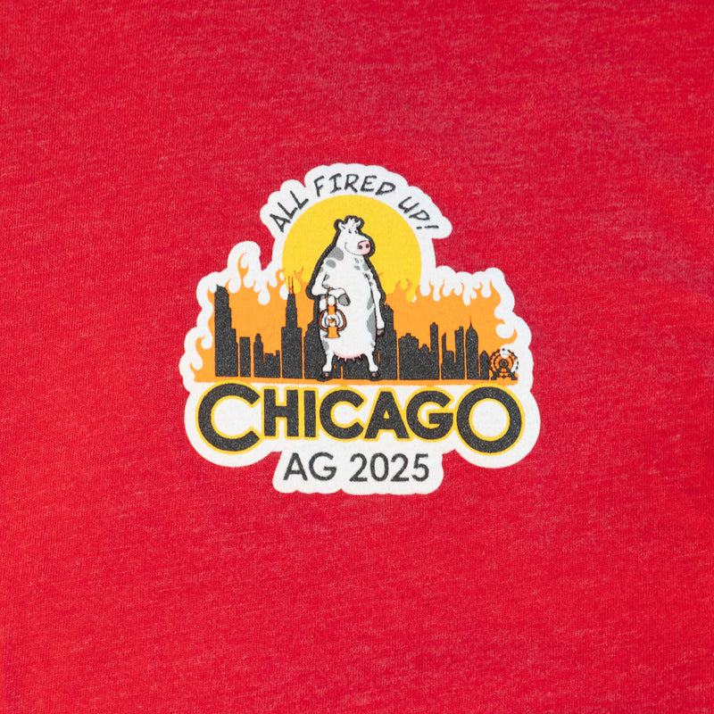 closeup of graphic on Red Mensa 2025 AG Chicago Unisex Tee, showing cow in front of Chicago skyline with text "ALL FIRED UP! CHICAGO AG 2025"