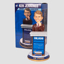 Ken Jennings bobblehead at Jeopardy desk in front of box
