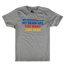 A heather gray short-sleeve crewneck t-shirt featuring a colorful graphic on the chest that reads 'MY BRAIN HAS TOO MANY TABS OPEN' in blue, red, and yellow text, with a blue and red striped bar graphic above it.