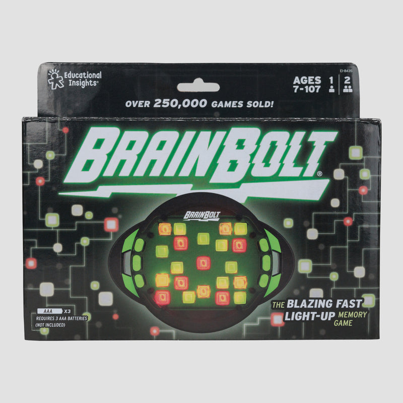 Brain bolt game in box, Oval game with green buttons on the front with text "Over 250,000 games sold! ages 7-107 1 or 2 players the Blazing Fast Light-up Memory Game requires 3 AAA batteries not included"