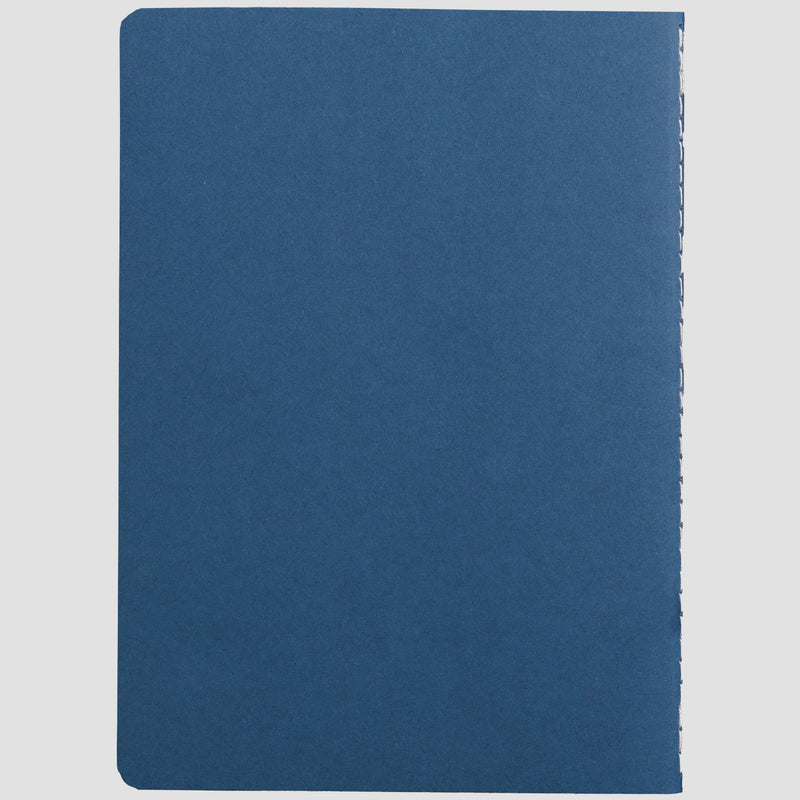 photo of mensa quote notebook in blue. spine visible on right white stitching.