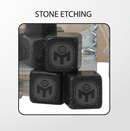 closeup of black whiskey stones with etched Mensa logo