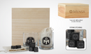 2 whiskey glasses with Black mensa logo on side with set of black whiskey stones with mensa logo etched on side included with a wooden carrying case with mensa logo and blank muslin bag